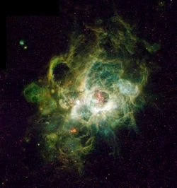 NGC 604، ناحیه‌ای از هیدروژن یونیزه شده در کهکشان مثلث.